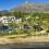 <p style="text-align: justify;">Esta agencia inmobiliaria internacional considera que el nuevo PGOM reforzará la confianza del inversor en Marbella ante una nueva etapa de crecimiento.</p>
 
<p style="text-align: justify;">Drumelia destaca la mayor seguridad jurídica que aporta el nuevo planeamiento y advierte que los 13 millones de m² adicionales considerados urbanos no se incorporarán de forma inmediata al mercado</p>
<p style="text-align: justify;">La compañía reclama que el desarrollo previsto vaya acompañado de mejoras en las conexiones y de una red eléctrica capaz de asumir las nuevas necesidades de la ciudad</p>
<p style="text-align: justify;">La aprobación definitiva del nuevo Plan General de Ordenación Municipal (PGOM) de Marbella reforzará la confianza de compradores e inversores internacionales al reducir una de las incertidumbres que durante años ha condicionado las decisiones inmobiliarias en la ciudad. Así lo considera Drumelia Real Estate, firma especializada en el mercado residencial prime y <em>superprime</em>, que señala a través de un comunicado la mayor previsibilidad como uno de los principales efectos inmediatos del nuevo planeamiento.</p>
<p style="text-align: justify;">El documento eleva de aproximadamente 40 a 53 millones de metros cuadrados la superficie considerada urbana en Marbella. Para Drumelia, sin embargo, esos cerca de 13 millones de metros cuadrados adicionales “no deben interpretarse como suelo que vaya a incorporarse de forma inmediata al mercado residencial ni como un aumento automático de la oferta de vivienda. El desarrollo de cada ámbito dependerá de su ordenación y de los procedimientos urbanísticos posteriores”, señala Artur Loginov, CEO y copropietario de Drumelia.</p>
<p style="text-align: justify;">“El nuevo PGOM permite mirar Marbella con un horizonte mucho más claro, pero no significa que desde mañana haya 13 millones de metros cuadrados nuevos disponibles para construir. El valor inmediato está en disponer de unas reglas más definidas sobre las que propietarios, compradores e inversores pueden tomar decisiones a largo plazo”, apunta Loginov.</p>
<p style="text-align: justify;">Con la aprobación de este documento Marbella se convierte en el primer municipio andaluz en contar con un PGOM adaptado a la Ley de Impulso para la Sostenibilidad del Territorio de Andalucía (LISTA). El nuevo planeamiento llega además a una ciudad cuyo desarrollo urbanístico ha seguido condicionado durante décadas por el Plan General de 1986. Su tramitación ha requerido más de 60 informes sectoriales, todos ellos favorables.</p>
<p style="text-align: justify;">Para Drumelia, la actualización tiene una relevancia especial en el segmento de mayor valor del mercado, donde la compra de una propiedad suele formar parte de decisiones patrimoniales planteadas a largo plazo.</p>
<p style="text-align: justify;">“En operaciones de varios millones de euros no se compra únicamente una vivienda. Se analiza qué puede ocurrir alrededor de ese activo, qué desarrollo tendrá la zona, qué infraestructuras están previstas y cuál es su situación urbanística. Que Marbella actualice un planeamiento que procede de 1986 reduce una incertidumbre que llevaba demasiado tiempo formando parte de esas decisiones”, explica Loginov.</p>
<p style="text-align: justify;">La compañía parte de su propia experiencia en el mercado prime y superprime de Marbella y la Costa del Sol. Desde 2021, Drumelia ha intermediado más de 20 operaciones por importes iguales o superiores a diez millones de euros, con un valor conjunto superior a 427 millones.</p>
<p style="text-align: justify;">La firma trabaja principalmente con una demanda internacional con un ticket medio de 4 millones de euros, para que la seguridad jurídica, la evolución del entorno y la capacidad de la ciudad para mantener su calidad de vida son elementos cada vez más presentes en el proceso de compra.</p>
<h3 style="text-align: justify;">Las infraestructuras, el siguiente reto</h3>
<p style="text-align: justify;">Drumelia considera que la aprobación del planeamiento resuelve una parte fundamental de la ecuación, pero advierte de que la capacidad de Marbella para aprovechar esta nueva etapa dependerá también de que las infraestructuras evolucionen al mismo ritmo que la ciudad.</p>
<p style="text-align: justify;">La movilidad constituye uno de los principales retos. La A-7 continúa siendo el gran eje de conexión de Marbella con el resto de la Costa del Sol y concentra importantes volúmenes de tráfico, con episodios recurrentes de congestión en puntos especialmente sensibles como el corredor entre San Pedro de Alcántara y Puerto Banús. Para la compañía, mejorar las conexiones con Málaga, su aeropuerto y el resto del litoral, así como avanza en alternativas al vehículo privado, será determinante en los próximos años.</p>
<p style="text-align: justify;">A ello se suma la capacidad de la infraestructura energética. El crecimiento residencial, hotelero y empresarial de la Costa del Sol occidental ha incrementado las necesidades de suministro, mientras los propios documentos de planificación reconocen la necesidad de adaptar y reforzar la red eléctrica ante los nuevos escenarios de demanda.</p>
<p style="text-align: justify;">“El PGOM da a Marbella una herramienta para ordenar su crecimiento, pero el planeamiento por sí solo no resuelve los retos de una ciudad que ha cambiado enormemente. Si queremos seguir atrayendo inversión internacional y, cada vez más, a familias que establecen aquí su residencia, ese crecimiento tiene que ir acompañado de infraestructuras. Necesitamos mejores conexiones y una red eléctrica con capacidad suficiente para atender a los nuevos desarrollos. El crecimiento urbanístico y las infraestructuras tienen que avanzar al mismo ritmo”, sostiene Loginov.</p>
<p style="text-align: justify;">Para Drumelia, estas cuestiones están directamente relacionadas con la capacidad de Marbella para conservar su posición dentro del mercado residencial internacional. La firma observa entre sus clientes que la elección de una vivienda ya no depende exclusivamente de la propiedad. Les importa los tiempos de desplazamiento, la proximidad al aeropuerto, los colegios, los servicios disponibles durante todo el año o la calidad del entorno forman parte de la decisión.</p>
<p style="text-align: justify;">“Marbella no necesita crecer a cualquier precio. Necesita crecer sin deteriorar aquello que hace que un comprador internacional la elija frente a otros destinos. La movilidad, los suministros, los servicios y la calidad urbana también forman parte del valor de una propiedad”, añade el CEO de Drumelia.</p>
<p style="text-align: justify;">La compañía considera, por tanto, que la aprobación del nuevo PGOM marca un punto de inflexión para Marbella. La actualización del marco urbanístico aporta una mayor previsibilidad a propietarios e inversores, al tiempo que abre una nueva etapa en la que el principal desafío será acompasar el desarrollo de la ciudad con las infraestructuras necesarias para sostenerlo.</p>
<h3 style="text-align: justify;">Sobre Drumelia</h3>
<p style="text-align: justify;">Drumelia Real Estate es una agencia inmobiliaria internacional fundada en Marbella en 2003 y especializada en el mercado residencial prime y superprime, con especial presencia en zonas como La Zagaleta, Sierra Blanca y la Milla de Oro. La compañía cuenta con un equipo de 30 profesionales de 15 nacionalidades y una estructura propia que integra ventas, marketing, asesoramiento legal y fiscal, finanzas y operaciones. <br>Su modelo combina conocimiento del mercado local, alcance internacional, tecnología, producción de contenidos y análisis de datos para acompañar a compradores y propietarios durante todo el proceso inmobiliario. A lo largo de más de dos décadas, Drumelia ha desarrollado una trayectoria basada en la profesionalización del asesor, la formación interna del talento, la innovación y un servicio centrado en la transparencia, la discreción y la representación de los intereses del cliente.</p>
<p>&nbsp;</p>