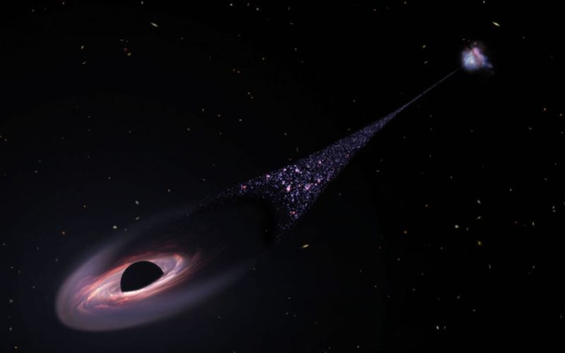 El Hubble observa un posible agujero negro fuera de control creando un rastro de estrellas